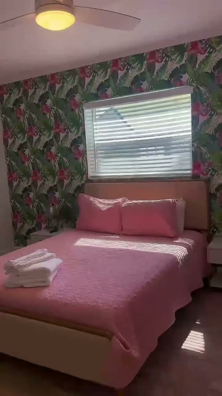 Frame from a property video: Staged bedroom walkthrough